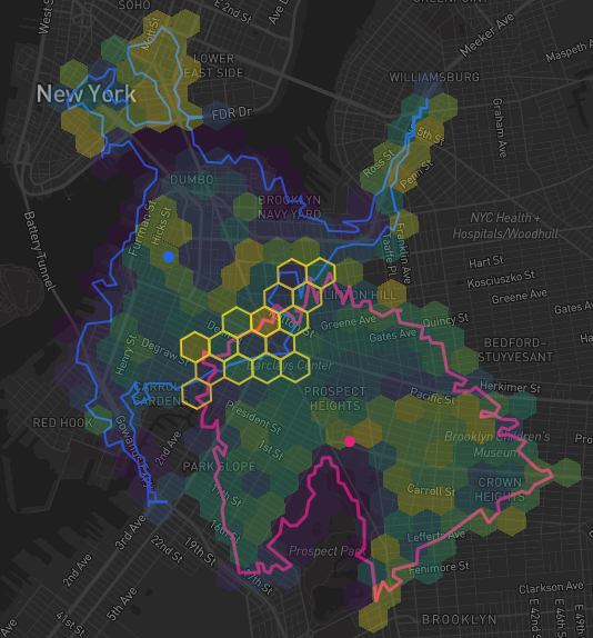 Map of New York City showing two drive-time territories drawn as hex areas with blue and pink outlines, and the hexes shared by both highlighted in gold as the overlap area